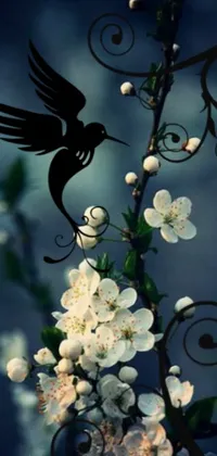 This lovely live wallpaper features a charming bird resting on a tree branch adorned with white flowers delicately arranged in an ikebana style