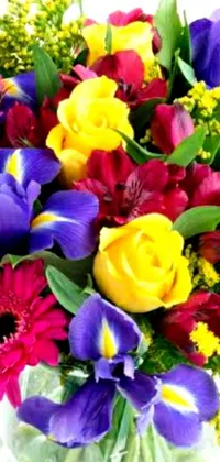 Enjoy a stunning live wallpaper for your phone showcasing a colorful vase filled with a variety of flowers
