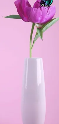 This stunning phone live wallpaper showcases an artful postminimalist design, featuring a white vase with a breathtaking purple flower