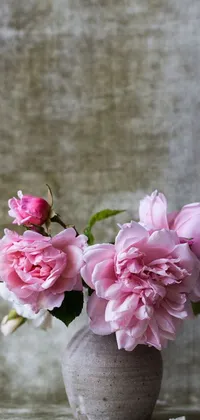 This phone live wallpaper features a vase brimming with exquisite pink flowers