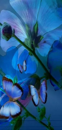 This phone live wallpaper showcases a beautiful digital art of a blue delphinium flower with butterflies on it