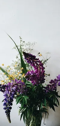 Enhance your phone's aesthetics with this stunning live wallpaper! With an unsplash background, a beautiful vase filled with both purple and yellow flowers, herbs, and other plants bring the beauty of nature to your phone screen