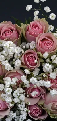 Enhance your phone's aesthetics with this mesmerizing live wallpaper that showcases a bouquet of stunning pink roses and dainty white baby's breath