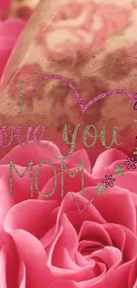 This live wallpaper features a beautiful, pink rose adorned with the message "I love you Mom" in striking digital typography