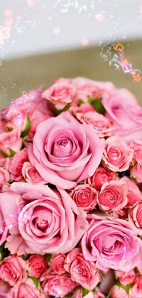 This phone live wallpaper features a breathtaking bouquet of pink roses displayed on a rustic wooden table