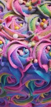 This phone live wallpaper features a mesmerizing, multi-colored cake set on a white, glossy table
