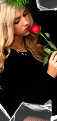 This live wallpaper features a stunning woman with long blonde hair and piercing blue eyes, holding a red rose in her arms