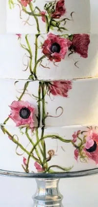 This stunning live phone wallpaper showcases a realistic white cake adorned with pink flowers and intricate icing