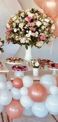 This beautiful phone live wallpaper features a charming table topped with pink and white balloons, adding a playful touch to the brown and white colored scheme