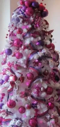 This phone live wallpaper features an exquisite white Christmas tree adorned with bright pink and purple ornaments, creating a stunningly picturesque display