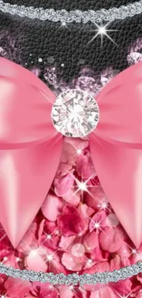 This live phone wallpaper features a stunning close-up shot of a pink bow, topped with a sparkling, diamond jewel at its center