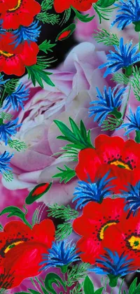 This lively and vibrant wallpaper features a bunch of red and blue flowers surrounded by lush green leaves