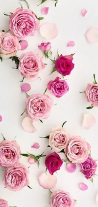 Looking for an elegant and romantic wallpaper for your phone? This beautiful live wallpaper features a white table adorned with pink flowers and intricate florals, capturing the essence of nature's beauty and charm