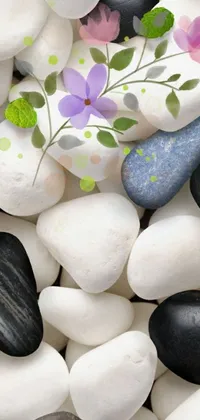 This phone live wallpaper features a stunning digital rendering of rocks sitting atop a bed of white stones