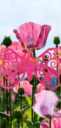 This phone live wallpaper features a digital rendering of a pink butterfly resting on a field of colorful flowers