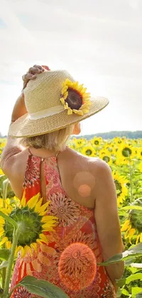 Brighten up your phone screen with this stunning live wallpaper of a woman in a field of sunflowers