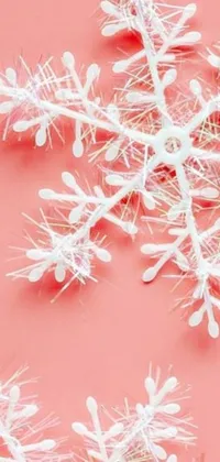 This phone live wallpaper is a digital rendering of a snowflake up close, featuring intricate details that give the impression of suspension in mid-air