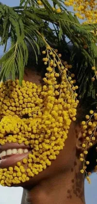 This phone live wallpaper showcases a beautiful image of a woman decorated with yellow flowers