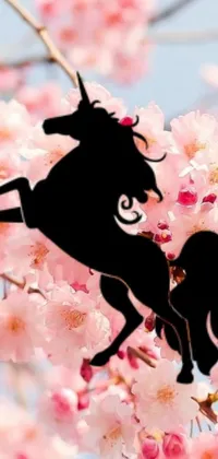 This dazzling live wallpaper for your phone showcases a close-up of a breathtaking horse standing on a tree branch against a cherry blossom background