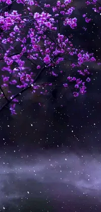 This phone live wallpaper depicts a tree with purple flowers set in a snowy landscape during a night scene with rain