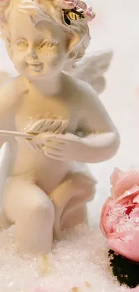 This romantic live wallpaper features a statue of cupid with a bow and flower in soft pink colors