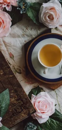 This phone live wallpaper showcases a quaint cup of tea on a wooden table