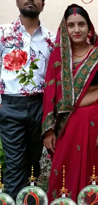 This live wallpaper features a stunning digital photograph of a man and woman standing together, dressed in flower-made clothes