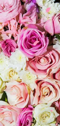 This stunning live wallpaper for your phone features a closeup of vibrant pink and white flowers on a beautiful background of soft roses