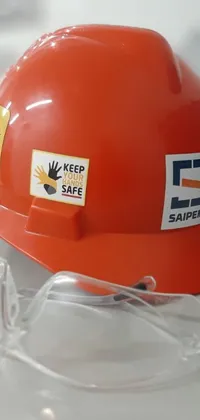This phone live wallpaper is a stunning image of a hard hat on a table
