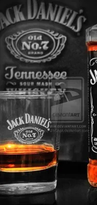 This phone live wallpaper showcases a glass of whiskey and a Jack Daniels bottle against a black background