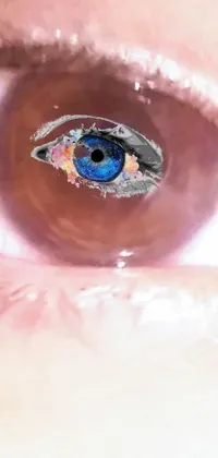 This surrealism live wallpaper displays an oversaturated image of a blue eye with eye implants