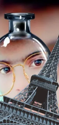 This live wallpaper is a digital art representation of a woman using a magnifying glass to look at the Eiffel Tower