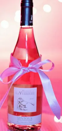 This stunning live phone wallpaper features a bottle of wine adorned with a lovely pink ribbon and bow