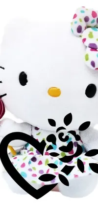 Decorate your phone screen in style with this live wallpaper featuring a cute hello kitty stuffed animal