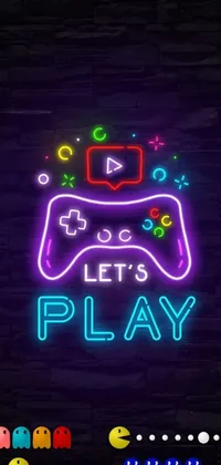 This live phone wallpaper features a bright neon sign displaying the words "let's play" with a video game controller, designed by Julia Pishtar