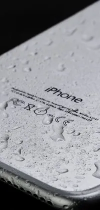 Get mesmerized with a stunning iPhone live wallpaper depicting droplets of water on its surface