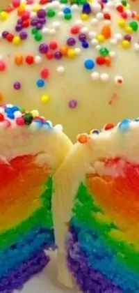 This lively phone live wallpaper features a colorful rainbow cake with white frosting and sprinkles