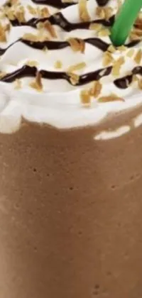 This live wallpaper showcases a luscious drink with a green straw, colored with a tempting blend of milk and mocha flavors