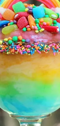 This stunning phone live wallpaper depicts a vibrant and playful fantasy dessert in a pastel rainbow of colors