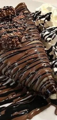 This phone live wallpaper is a close-up shot of a slice of chocolate cake with a cone swirl of white frosting on top, placed on a white plate
