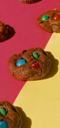 This live wallpaper features a delectable close-up shot of a chocolate cookie with colorful M&M's spread across its surface