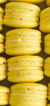 This live phone wallpaper features a yellow macaron stack by Jan Kupecký