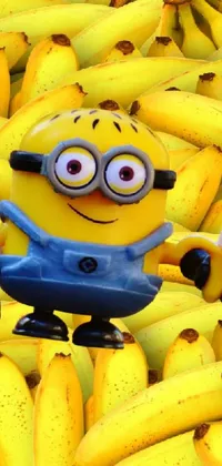 This live wallpaper for mobile phones features a bunch of bananas with a mischievous minion at the center