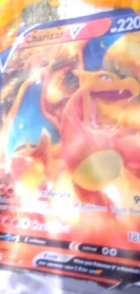 This live phone wallpaper displays a vivid close-up image of a Pokemon card box, featuring a high-tech Cybertronic Metallic Charmander