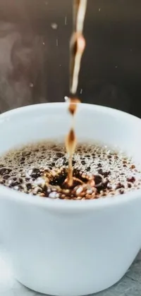 This captivating live wallpaper features a stunning close-up of a steaming cup of coffee on a plate, complete with pouring and steam emojis