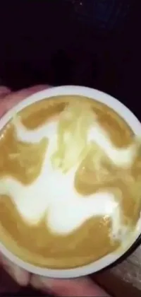 This beautiful live wallpaper features a close-up shot of a coffee cup, complete with swirling steam and scrolling Reddit feed in the background