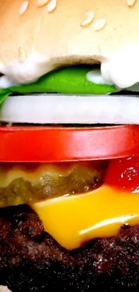 This cheeseburger live wallpaper is a feast for the eyes! Enjoy a close-up of a mouth-watering cheeseburger with juicy tomatoes and crisp lettuce