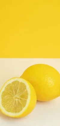 This phone live wallpaper is a beautiful postminimalism design of two lemons sitting together on a wooden table