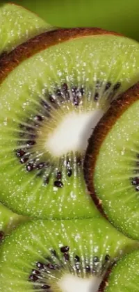This phone live wallpaper features a stack of juicy kiwi slices, presented in stunning digital rendering