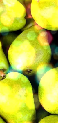 Get a stunning and refreshing live wallpaper for your phone with this image of green pears piled on top of each other
